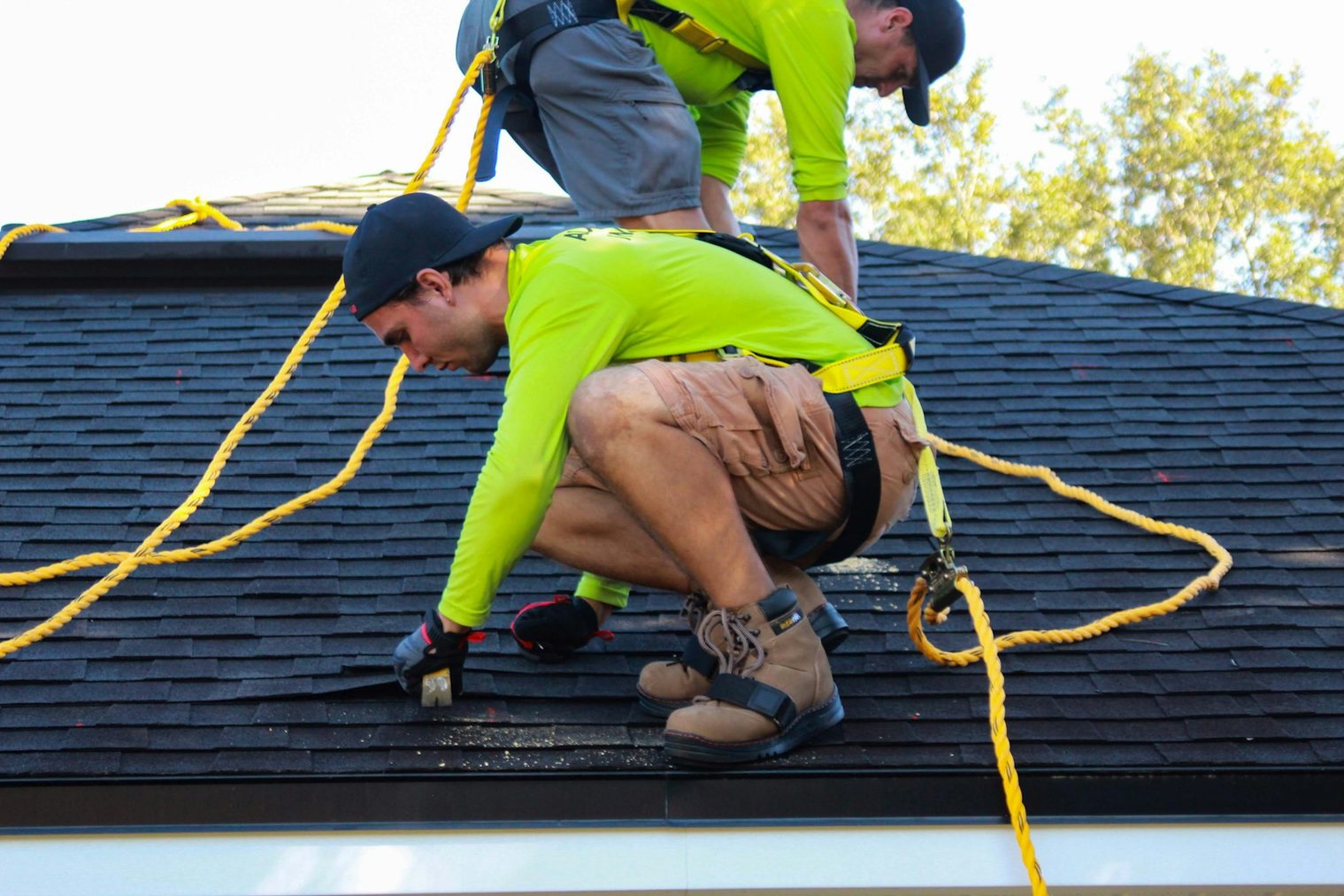 Longhorn Construction & Roofing crew working on a residential roof replacement