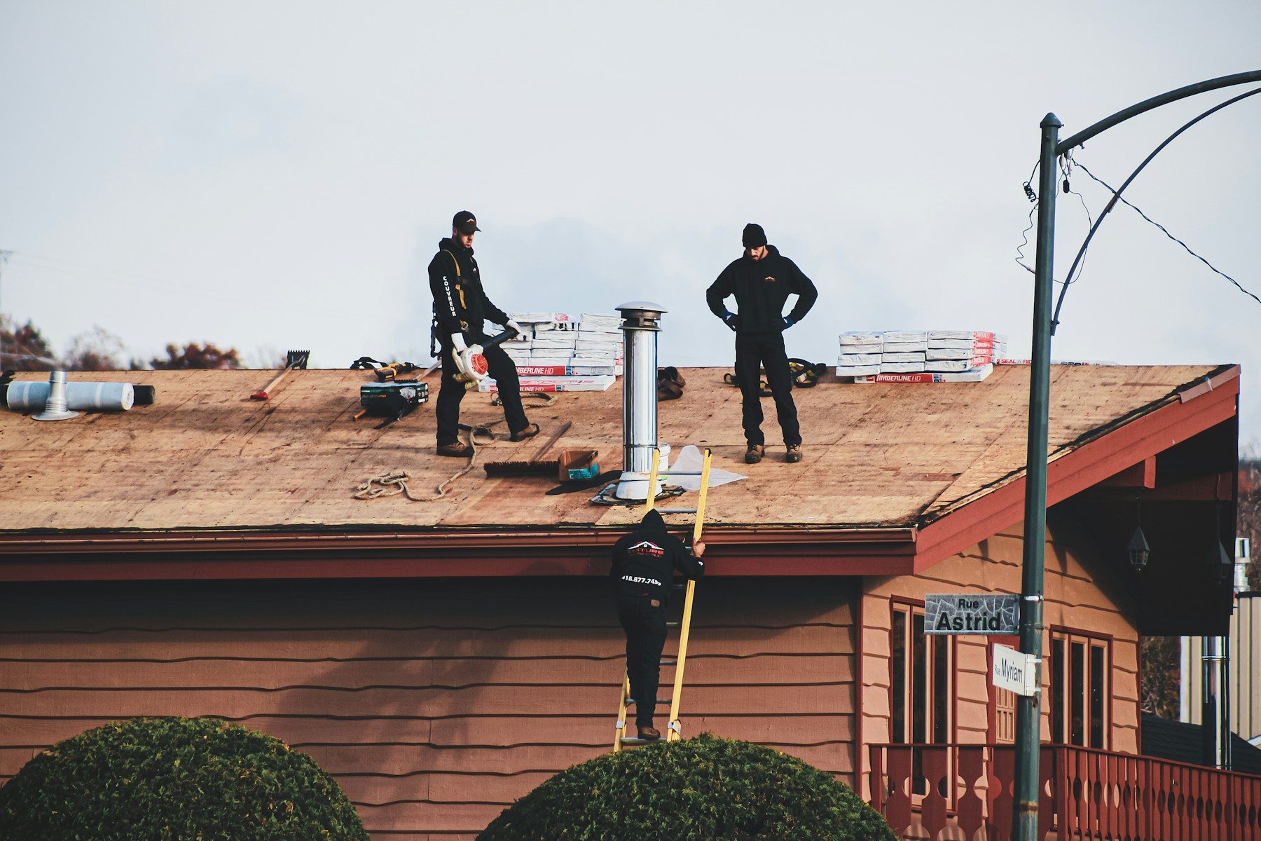 Longhorn Construction & Roofing crew assessing storm damage on a Northern Colorado roof